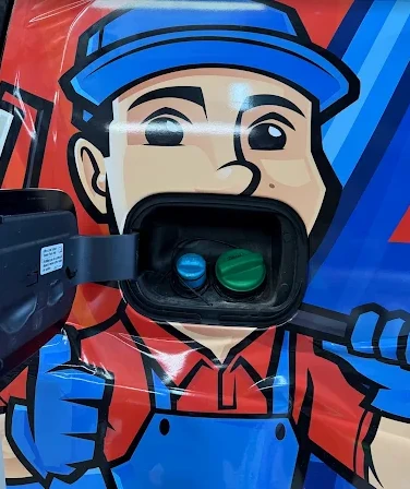 Close up detail of printed vinyl wrap graphics on a work van